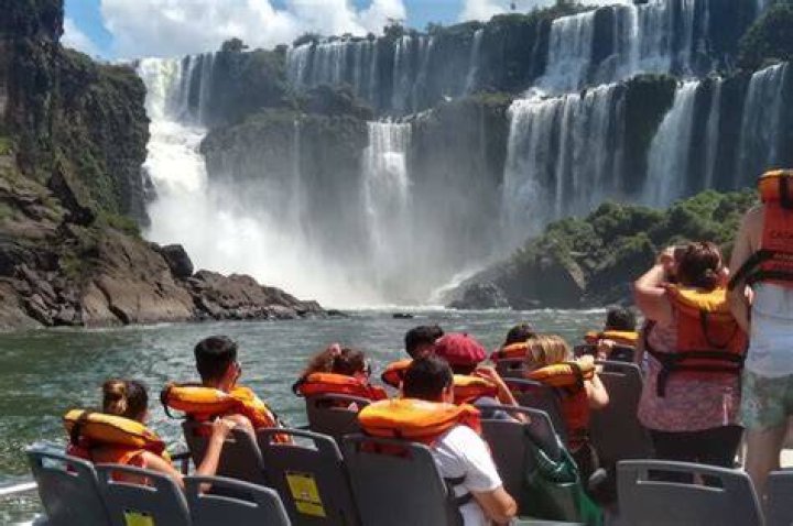 Where should I stay when visiting Iguazu Falls?